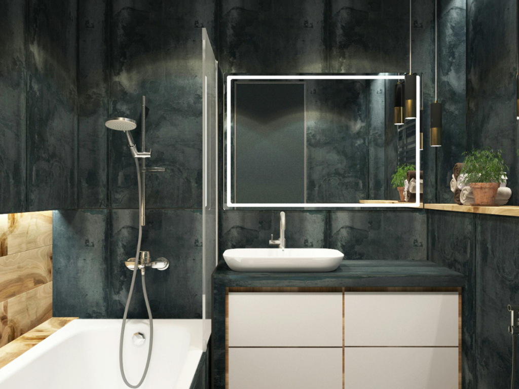 Ein modernes Badezimmerdesign mit dunklen Fliesenwänden, einer weißen Badewanne und einem Waschbecken mit einem Spiegel darüber. Holzregale enthalten Pflanzen und Toilettenartikel, während die Deckenbeleuchtung den Raum wunderschön beleuchtet.
