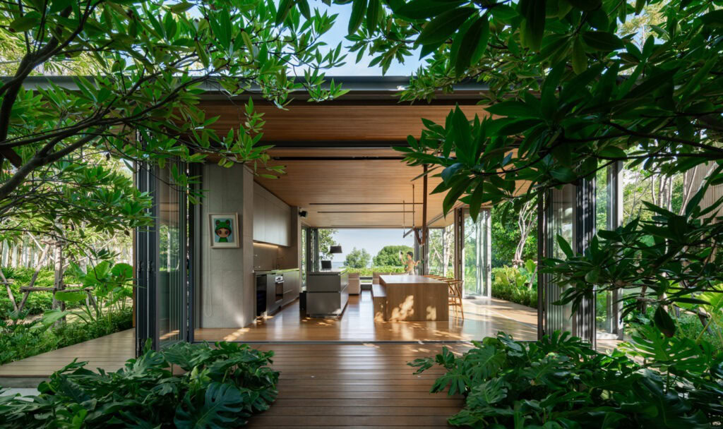 We design gardens that blend harmoniously with the interior spaces. Our landscaping here incorporates abundant greenery and strategically placed trees to maximize the entry of natural light, creating a seamless transition between indoors and outdoors.