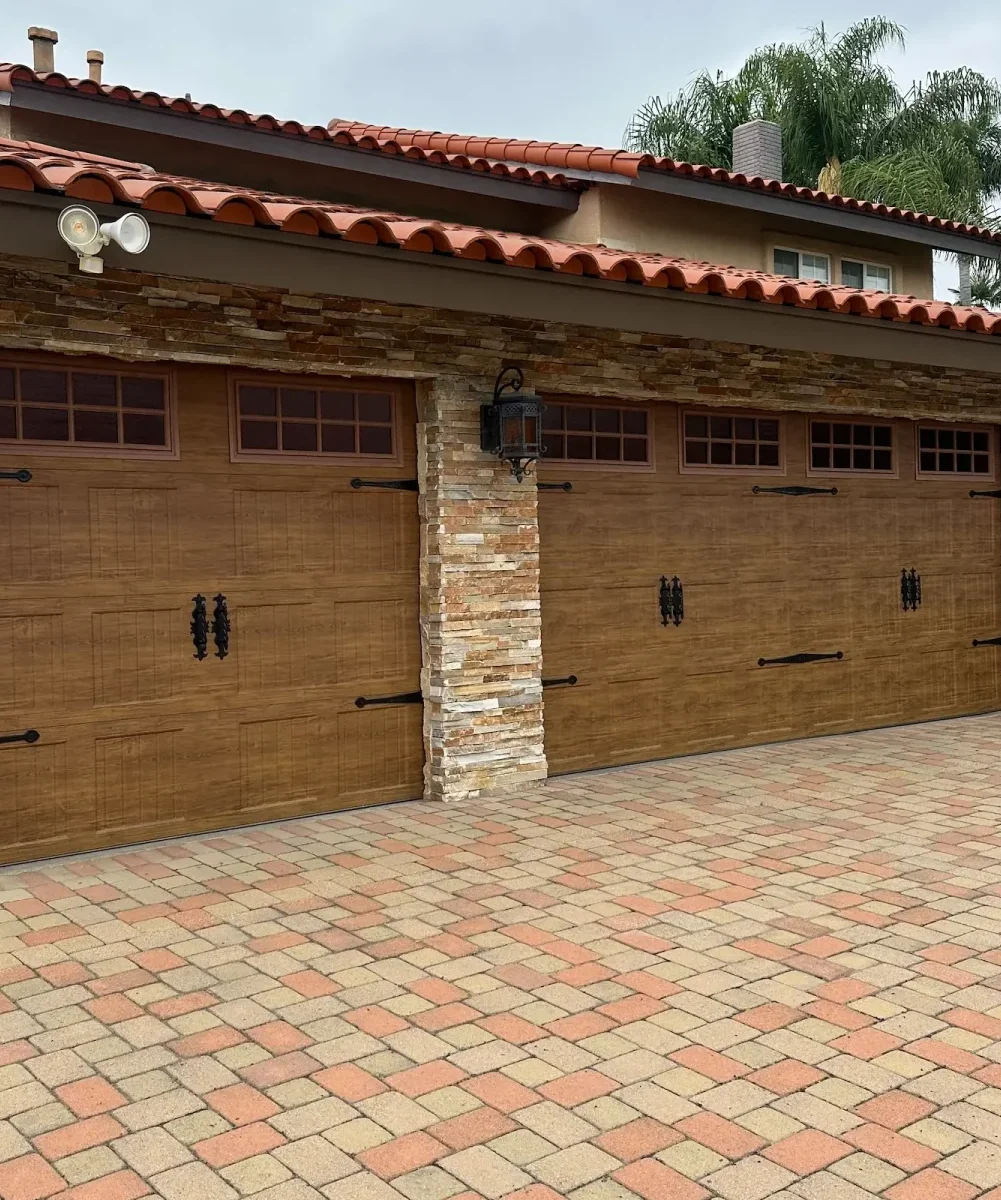 A house, a stone, a lantern-style, red-tiled roof, and a, red, and brown
