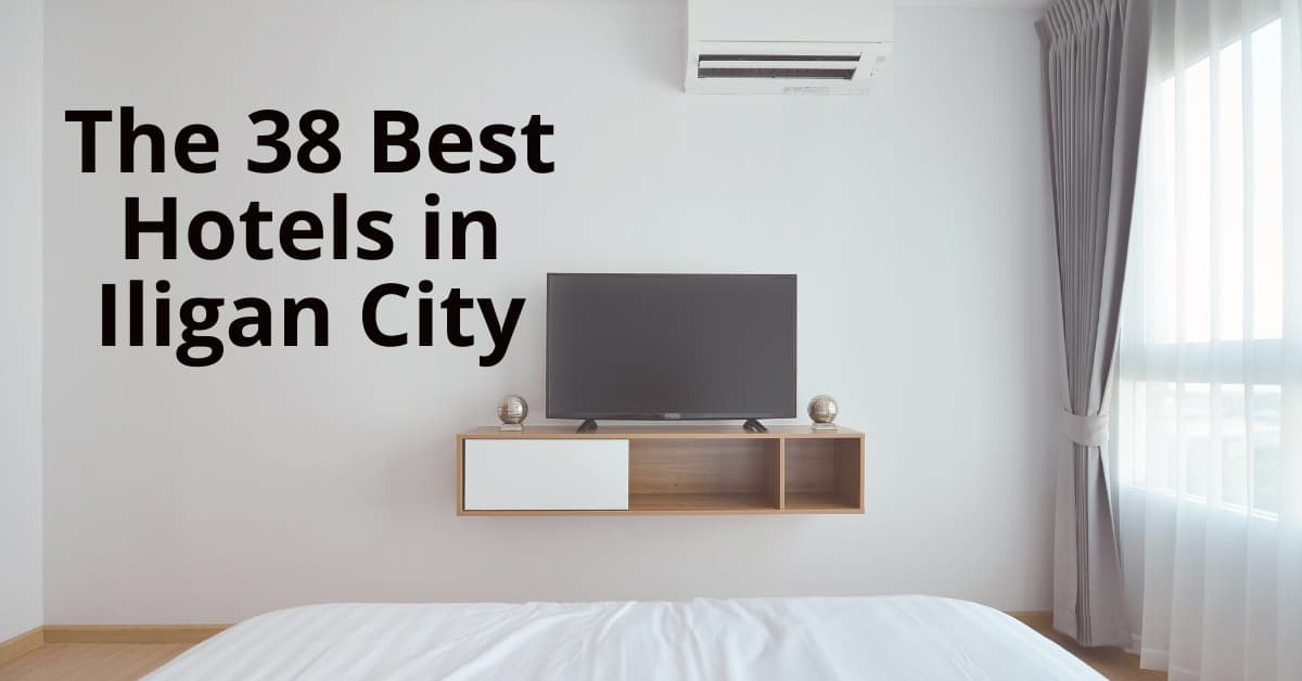 Minimalist hotel room na may TV, AC, puting bedding, at malaking bintana. Galugarin sa Iligan website para sa mga nangungunang hotel.