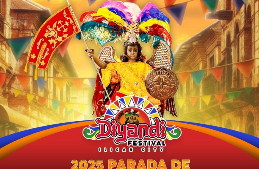 Isang batang nakasuot ng makulay na costume ng Santo Niño ang nagpopose na may mga banner at festival decor para sa Diyandi Festival ng Iligan Citys.