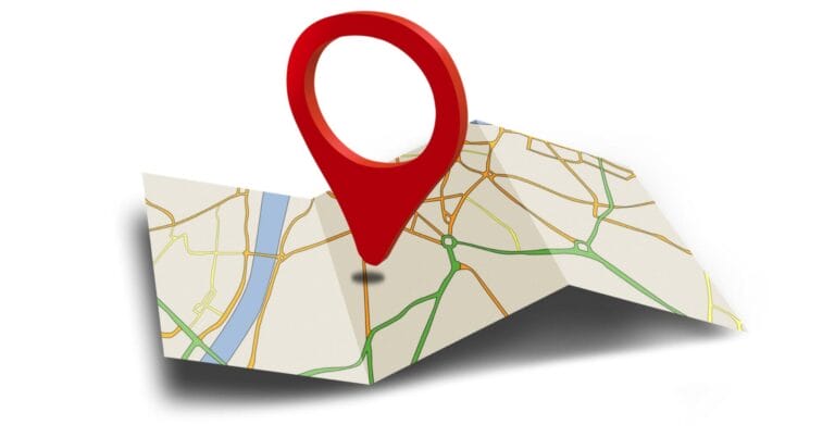 a folded map with a large red pin marks a spot, ideal for travel and tour operators in iligan city.