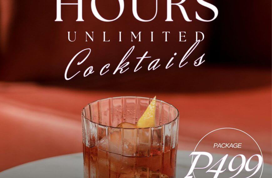 a cocktail with an orange twist on a table, with text offering unlimited cocktails for ₱499 at happy hour.