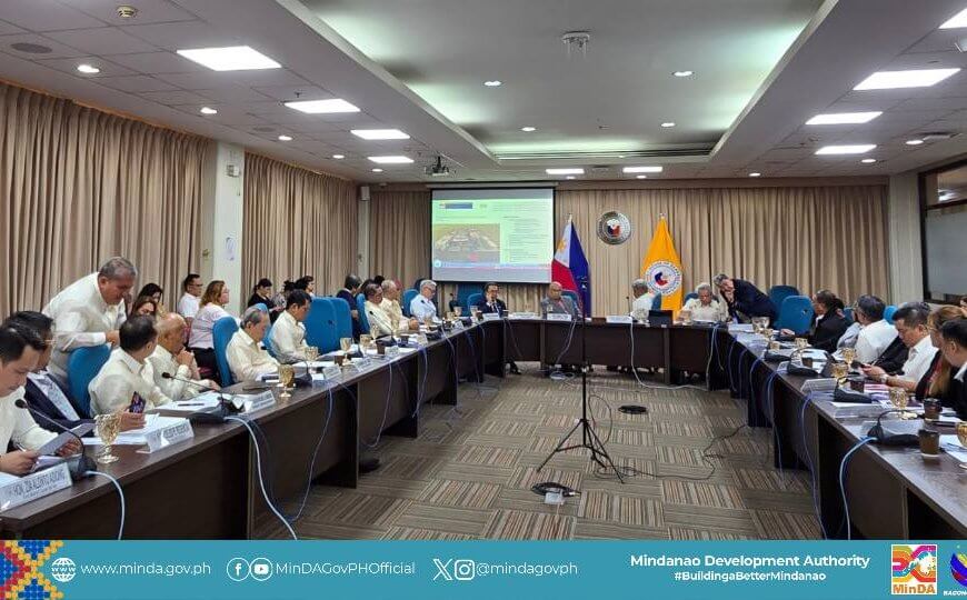 a large formal meeting on house bill 3595 is held in a conference room, with minda officials at a u shaped table.