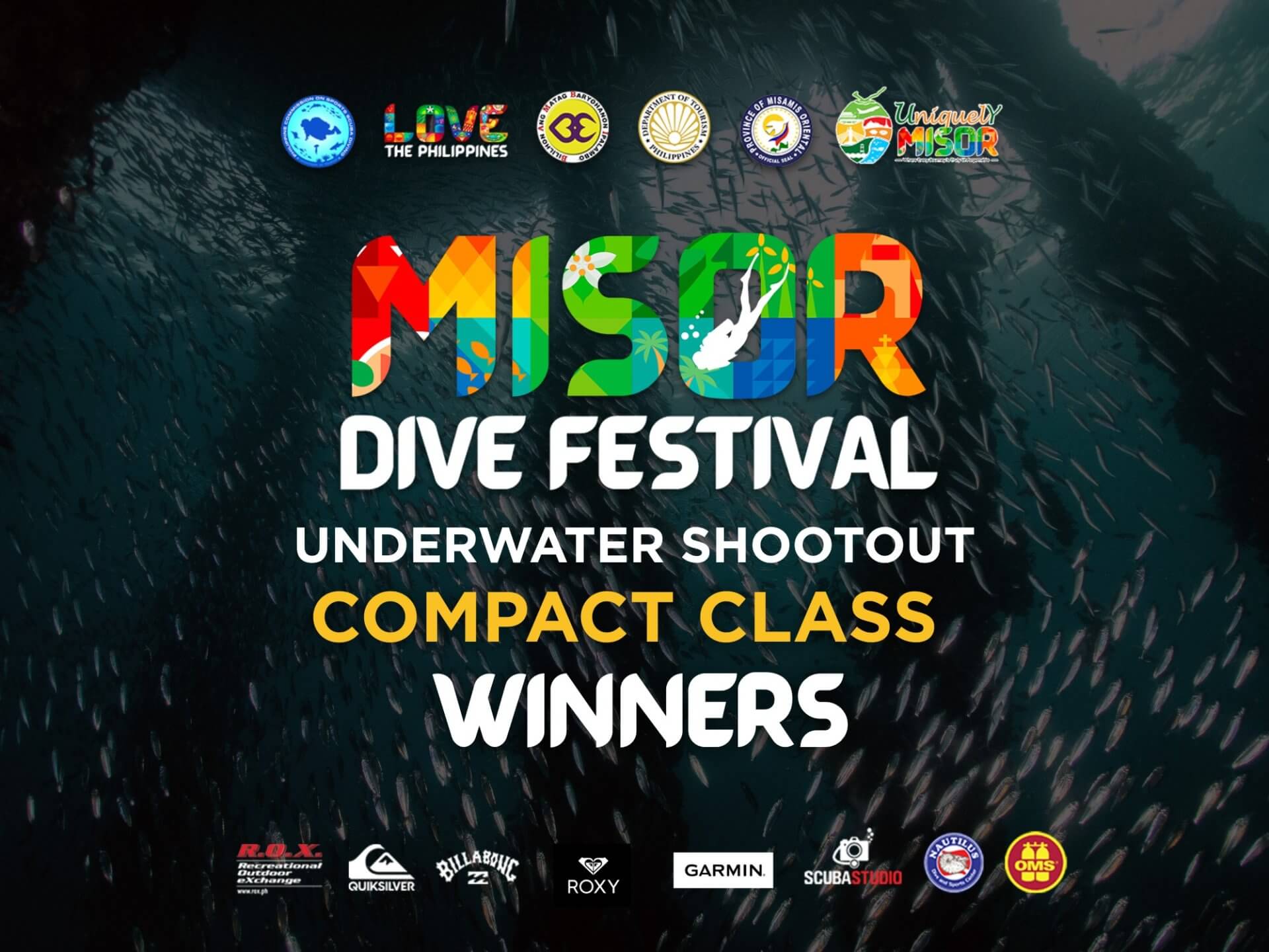 colorful misor dive festival underwater shootout compact class winners text over a dark underwater fish background.