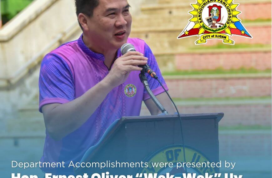 city vice mayor uy speaks at a podium outdoors, wearing a purple shirt, city seal and text overlayed.