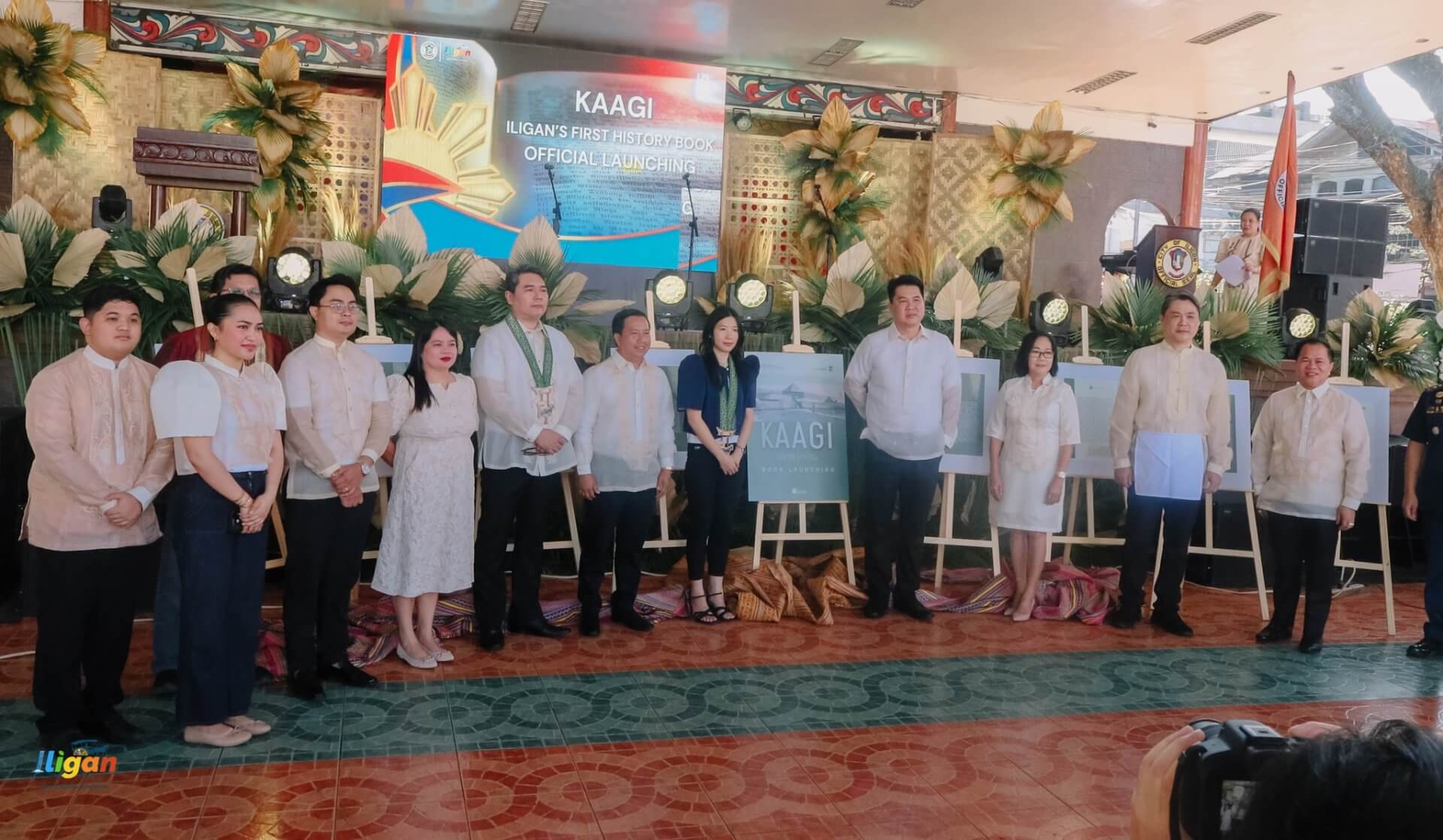 a group in formal attire poses on stage at the kaagi iligan history book launch in iligan city.