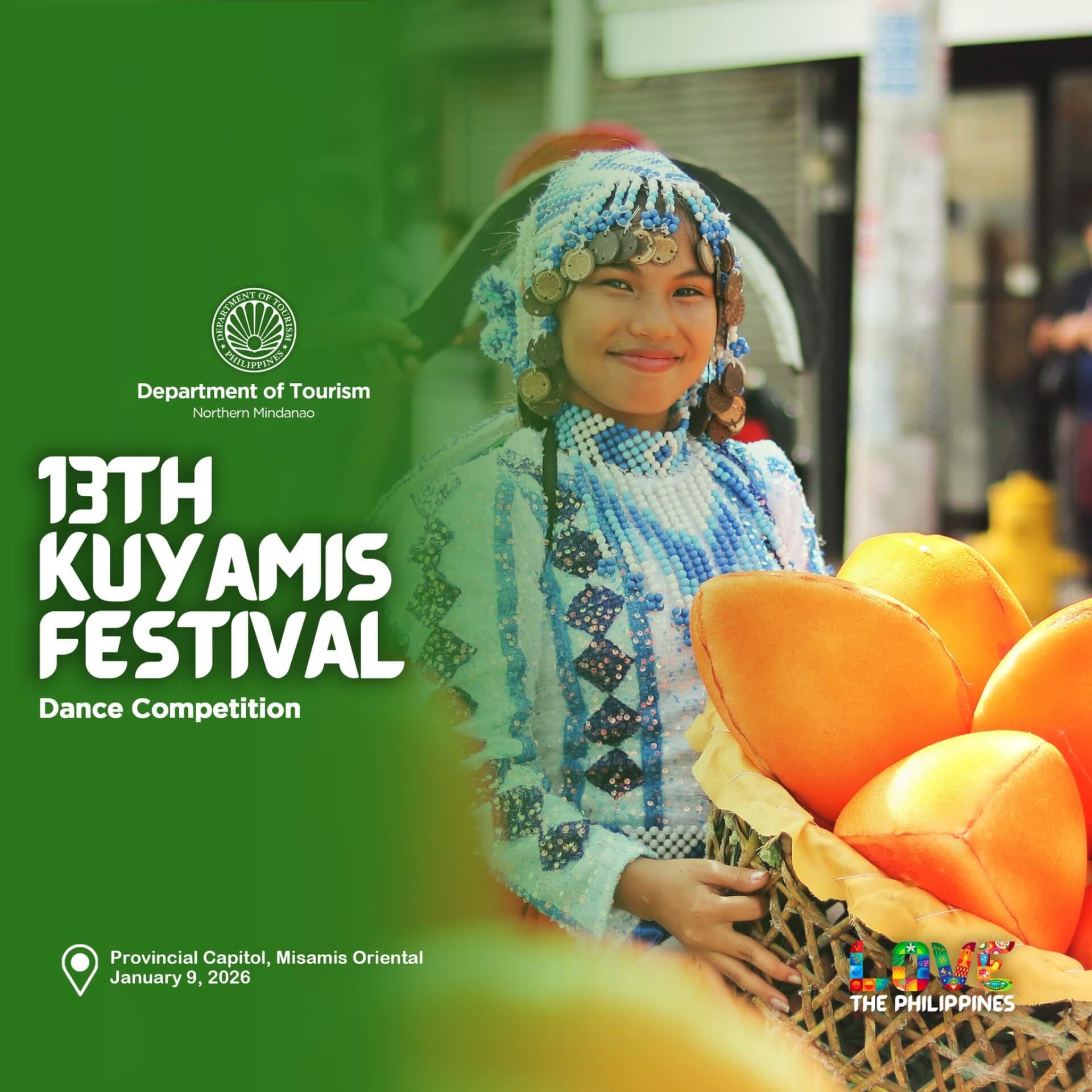 a smiling woman in a beaded costume holds kuyamis fruits at misamis oriental’s vibrant kuyamis festival.