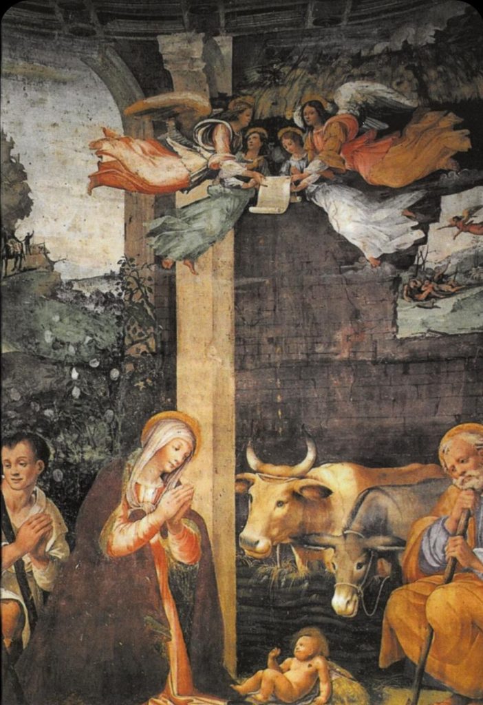 Pintura renacentista: María ora junto al Niño Jesús en el pesebre, con buey y burro detrás; pastores arrodillados y ángeles arriba sostienen un pergamino que dice "Feliz Navidad", mirando hacia abajo.