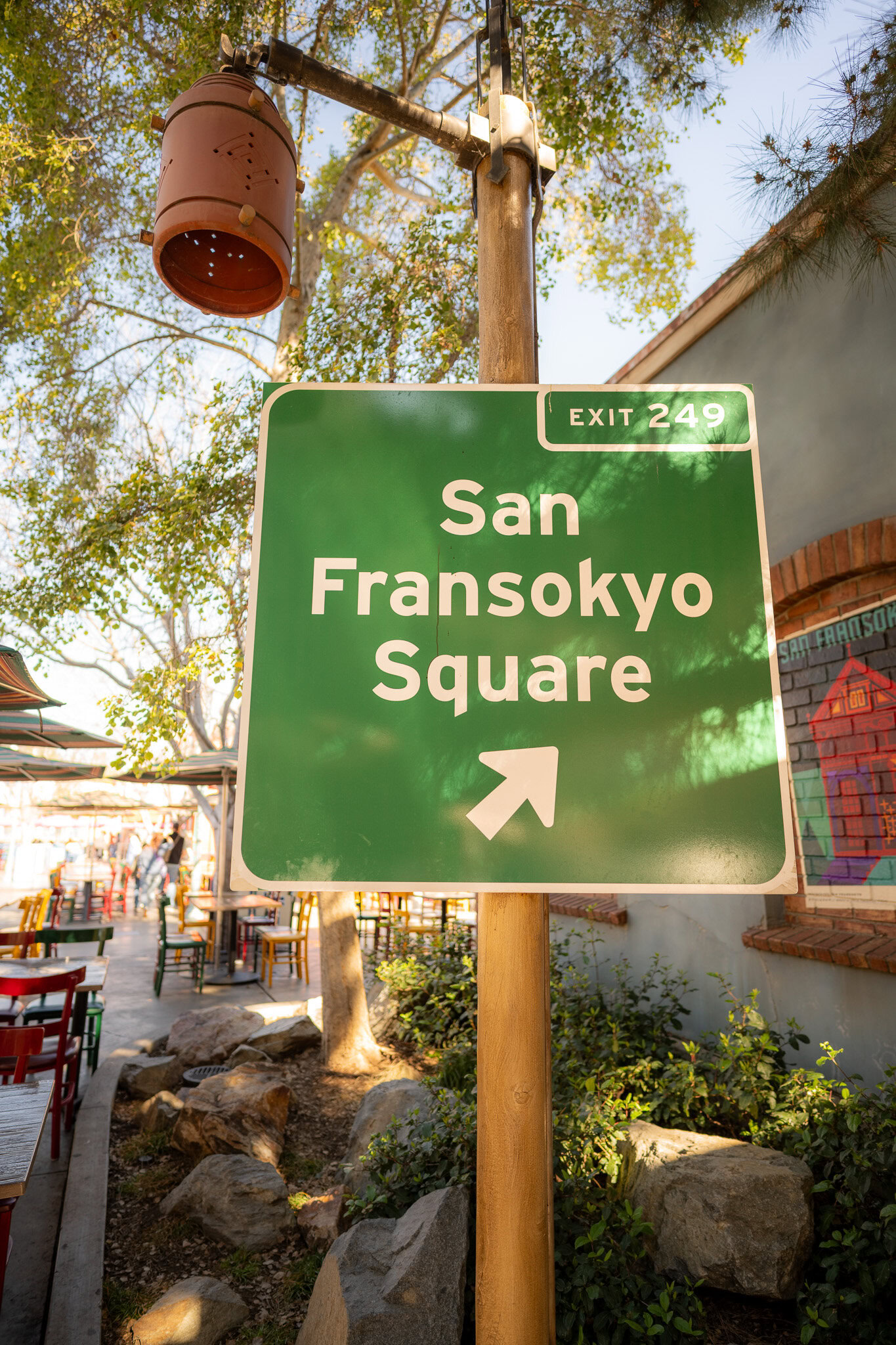 Green San Fransokyo Square sign in Disney California Adventure.