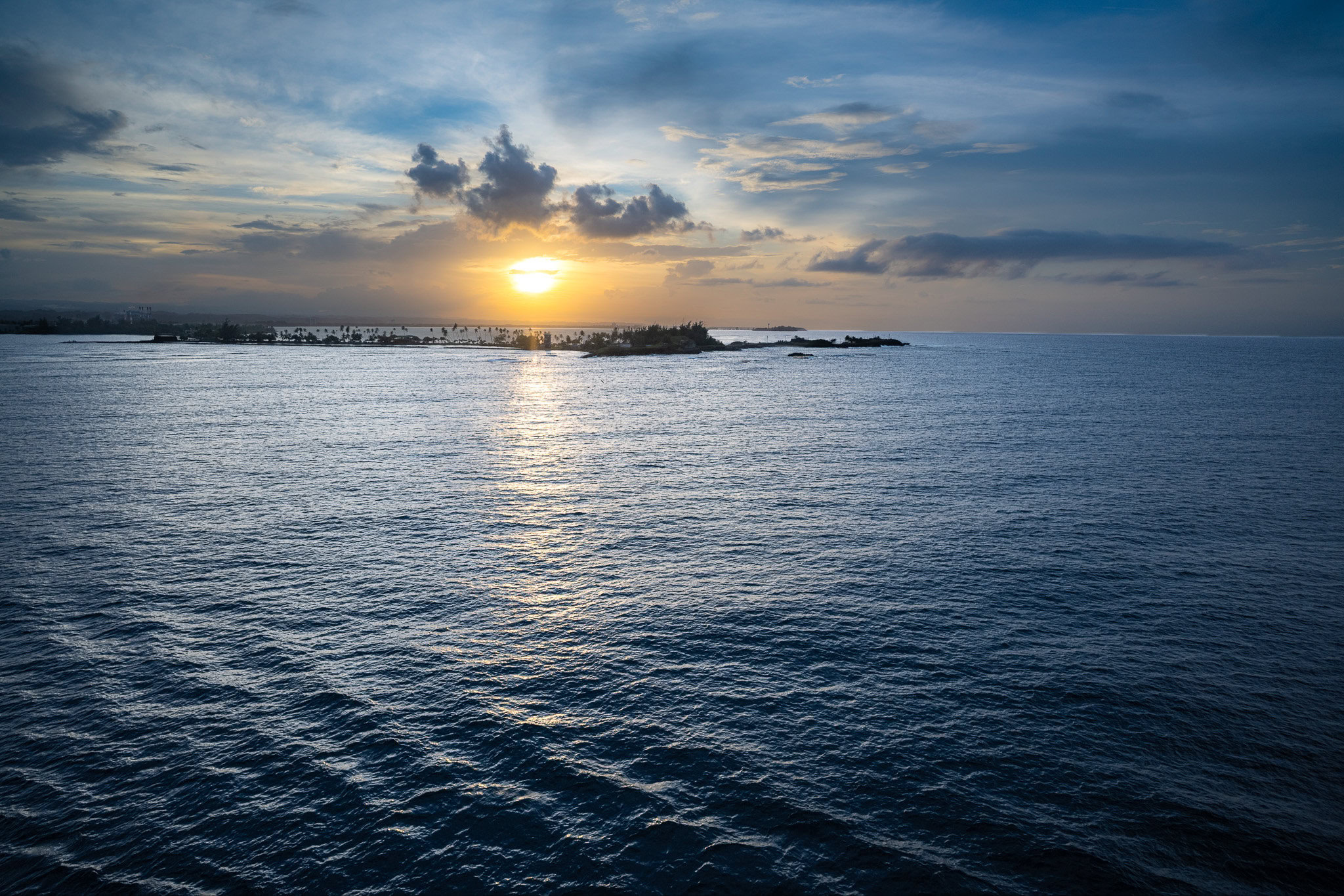 Caribbean sunset over San Juan Bay as the Disney Magic departs Puerto Rico on embarkation day.