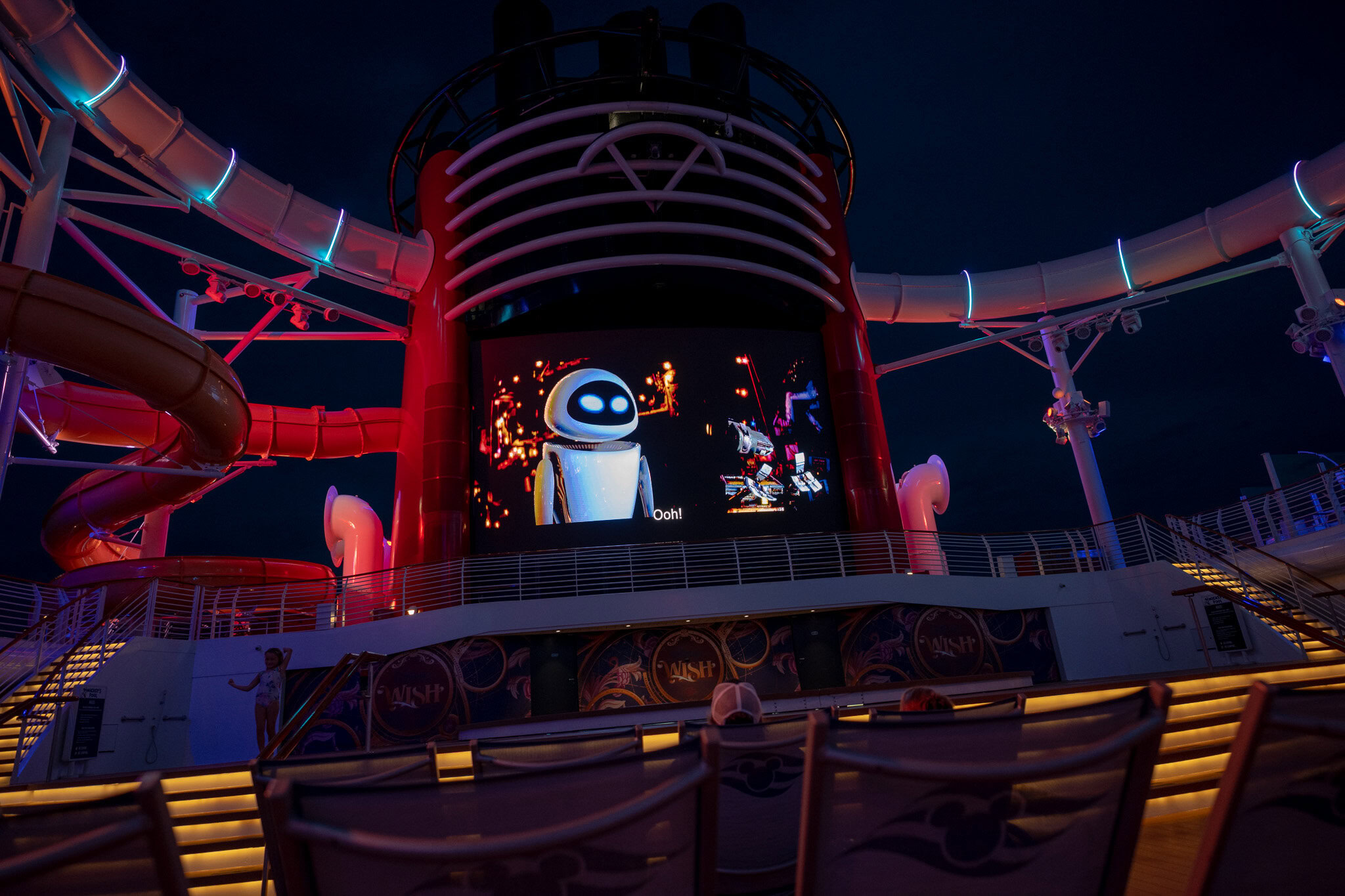 Wall-E playing on the upper deck movie screen of the Disney Wish. Improved Filename: disney-wish-upper-deck-movie-wall-e.jpg