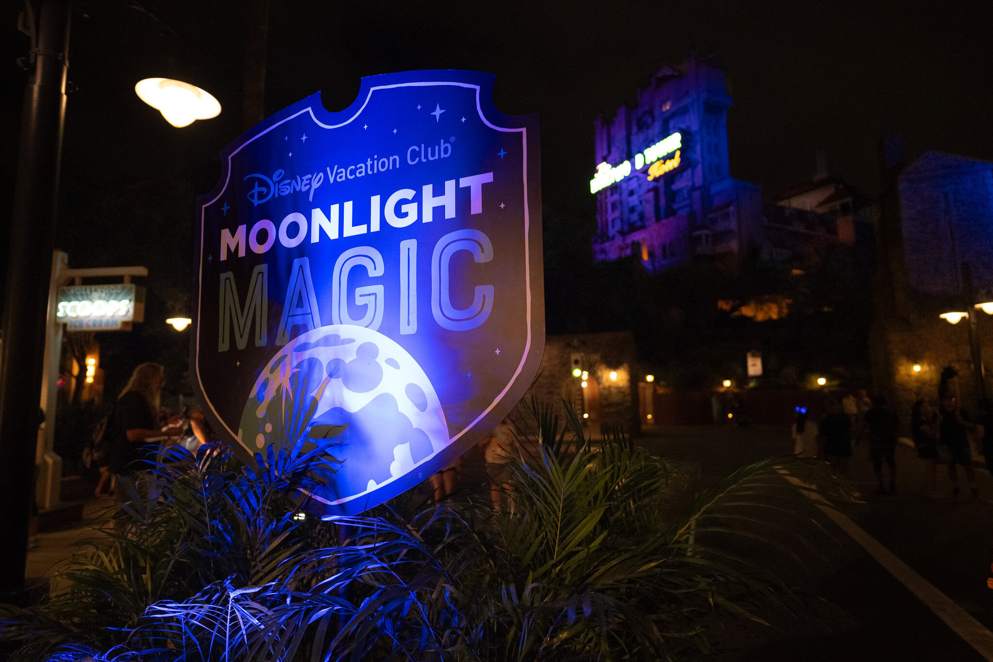 Disney Vacation Club Moonlight Magic sign with Tower of Terror in background