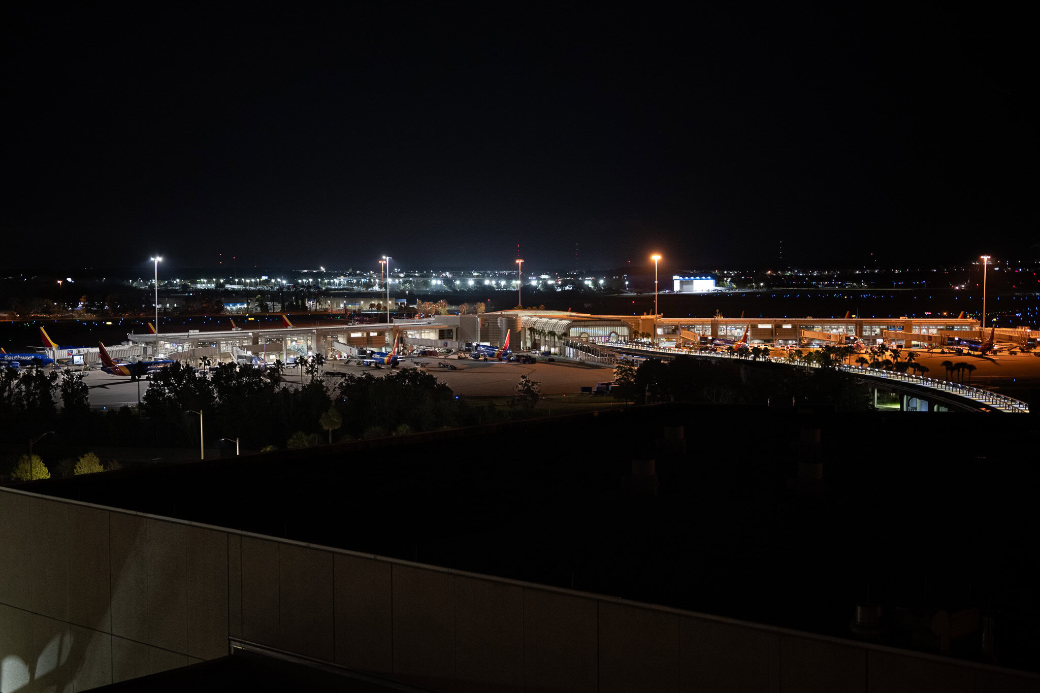 Diagonal night view of Orlando airport from Hyatt MCO hotel room window