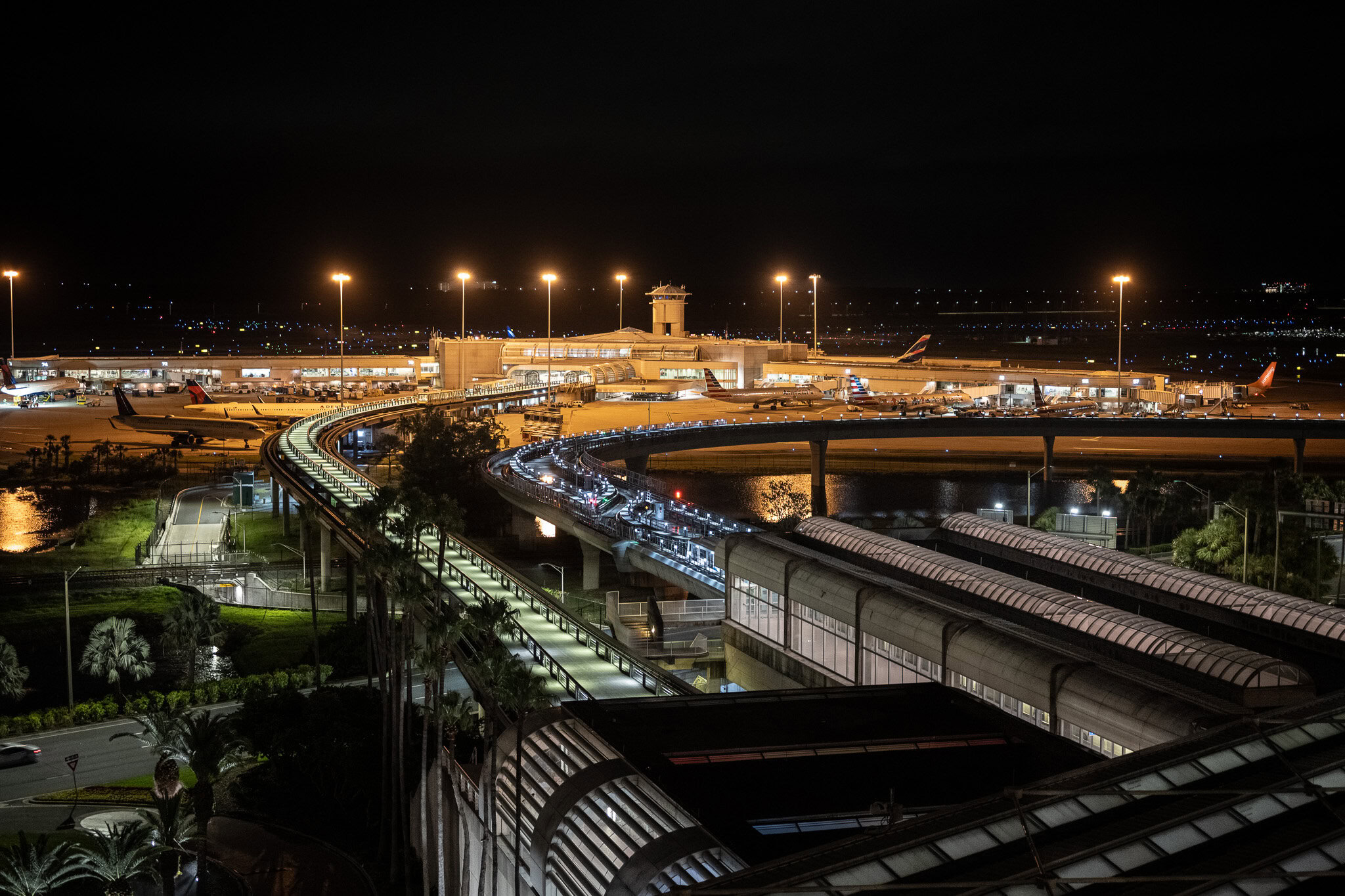 Aerial night view of Orlando airport tram system and terminal from Hyatt MCO