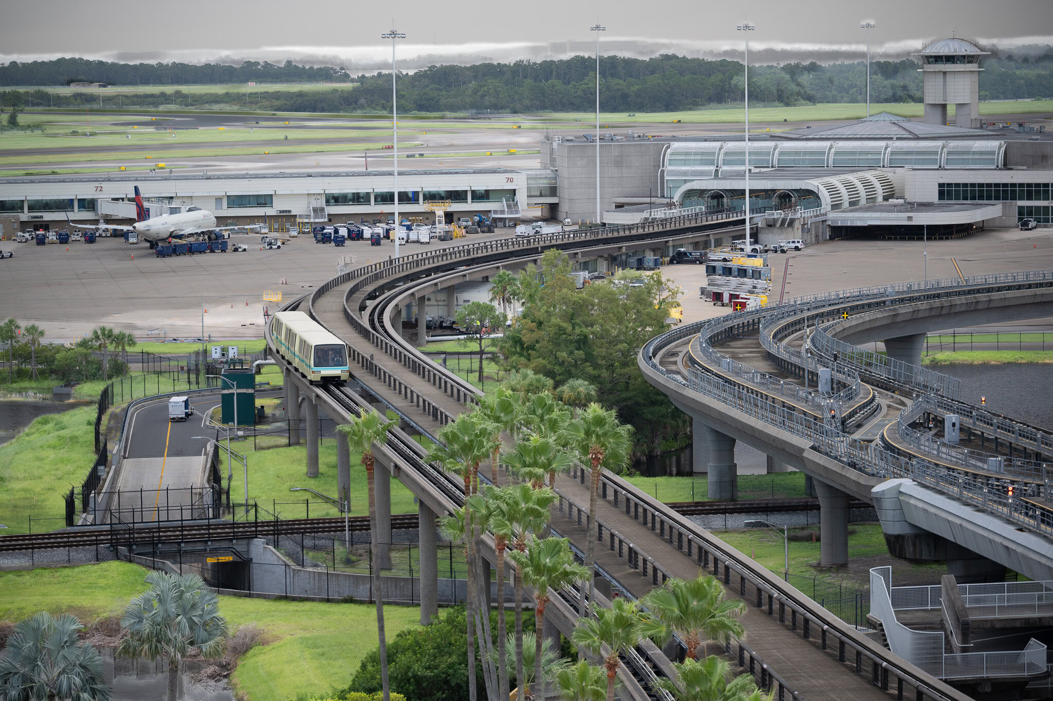 Orlando International Airport tram traveling toward main terminal