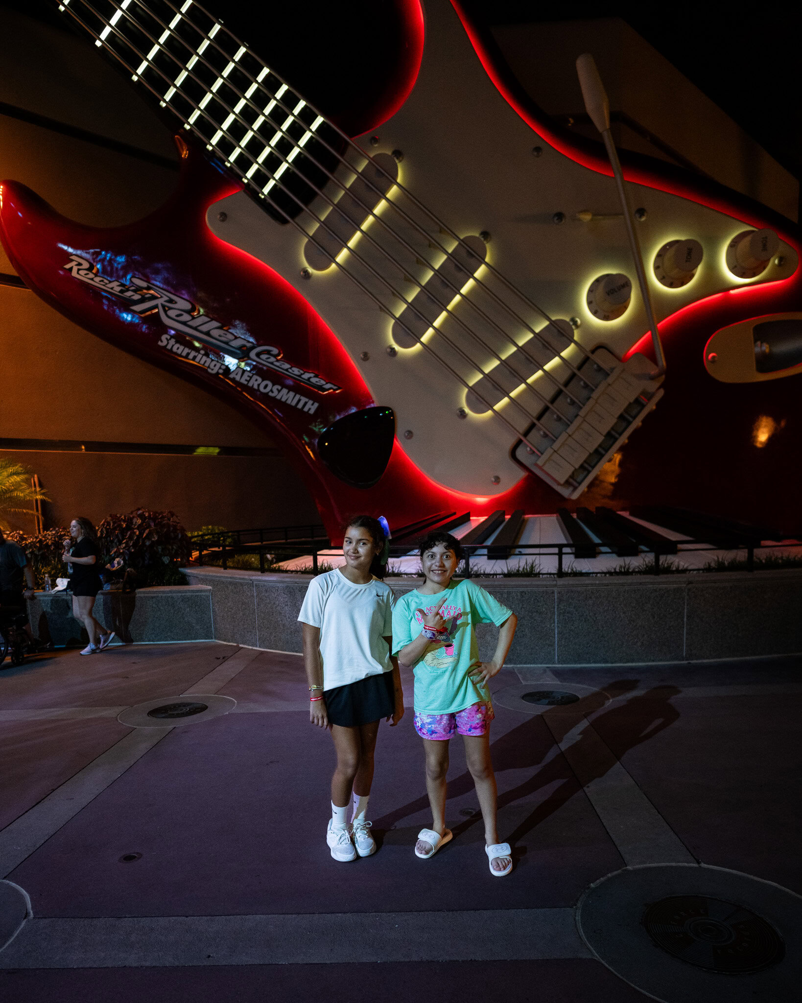 Daniela and Martina pose in front of Rock 'n' Roller Coaster during Moonlight Magic at Disney’s Hollywood Studios