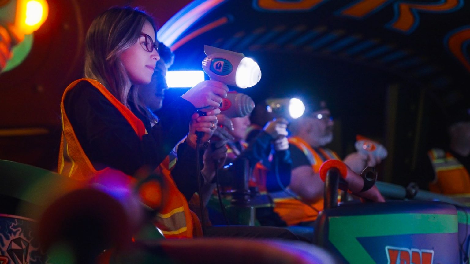 Walt Disney Imagineer testing an enhanced blaster for the Buzz Lightyear ride.