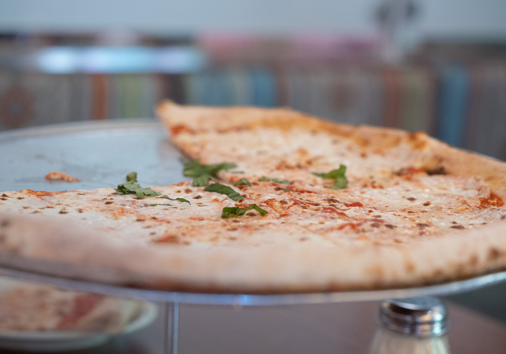 Cheese pizza with herbs served at Via Napoli restaurant in EPCOT