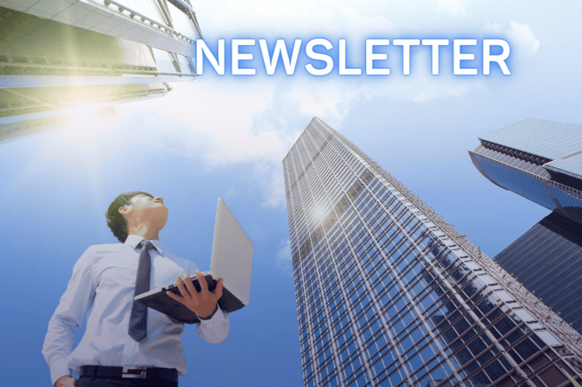 A person in a business suit is holding a laptop while looking up at a tall skyscraper under a bright blue sky, and the words "OES Newsletter" are written on the top.