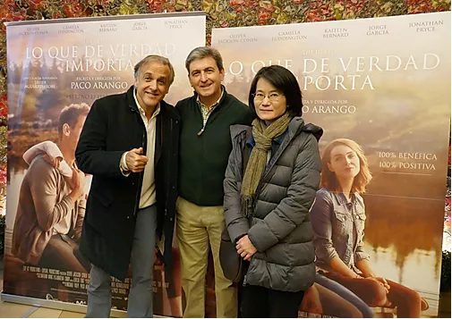 Paediatric palliative care Madrid Three adults from the CAPPI Fundación porqueViven team smile together at "What Really Matters" posters in Madrid. CAPPI Porque Viven Foundation