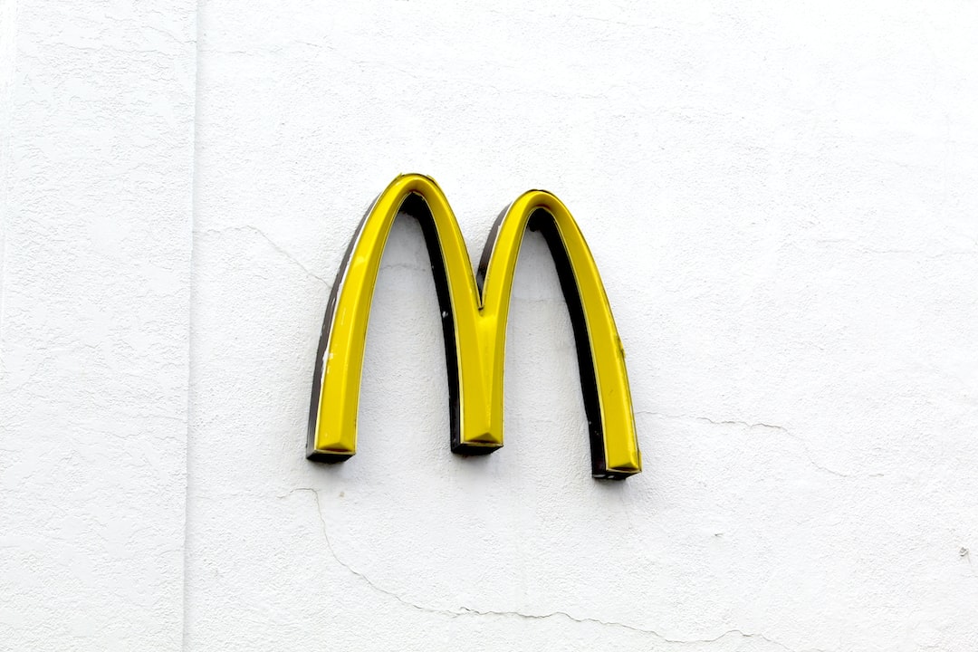 A mcdonald's sign on the side of a building.