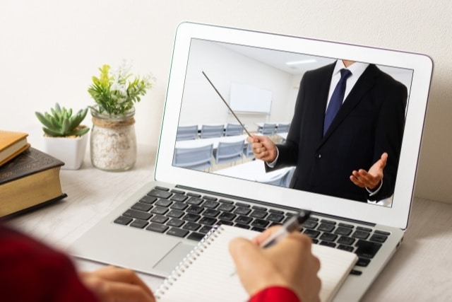 A person who takes notes on the content of the webinar