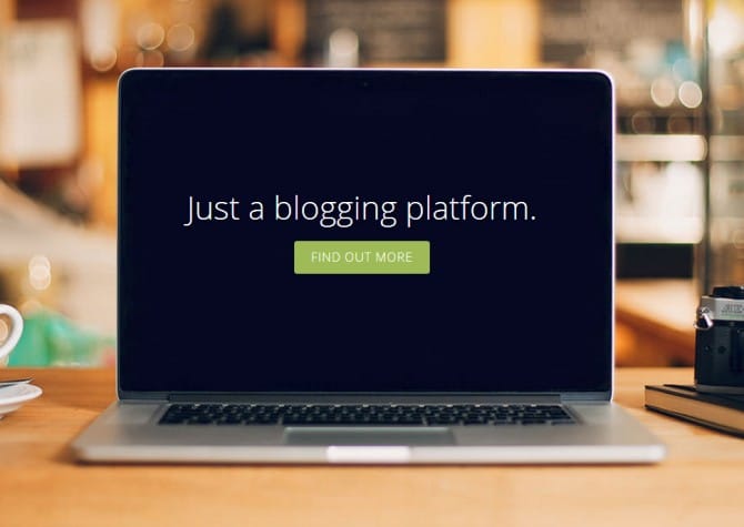 A laptop with the words just blogging platform on it.