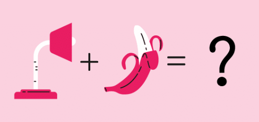 A banana and a lamp on a pink background.