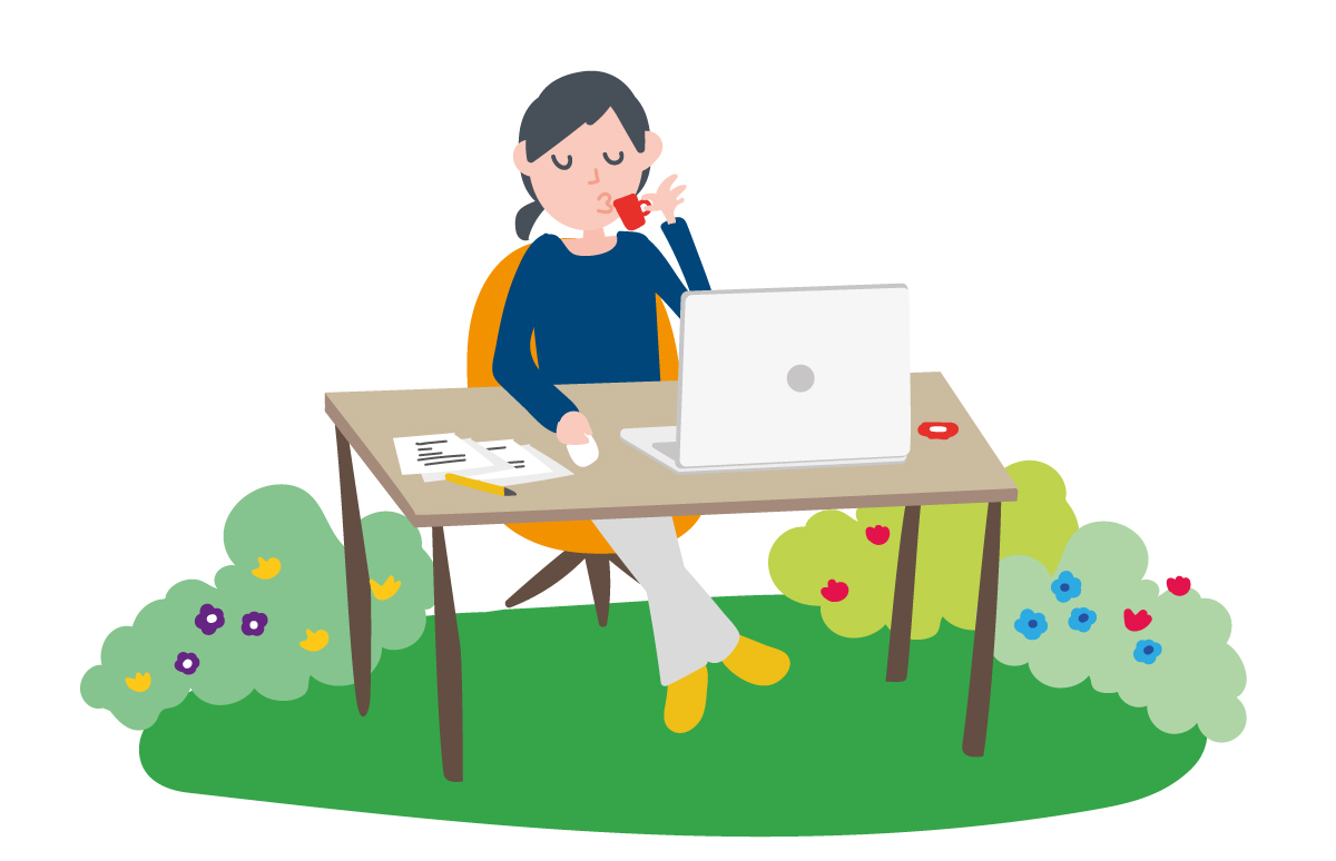 A woman sitting at a desk with a laptop.