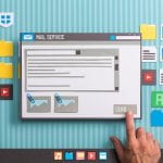 A hand points to a computer screen with many items on it.