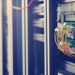 A rack server with many wires and cables for infomaniak hosting.