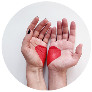 Two hands forming a symbol of love.