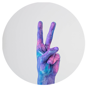 A hand painted blue and purple with a peace sign.