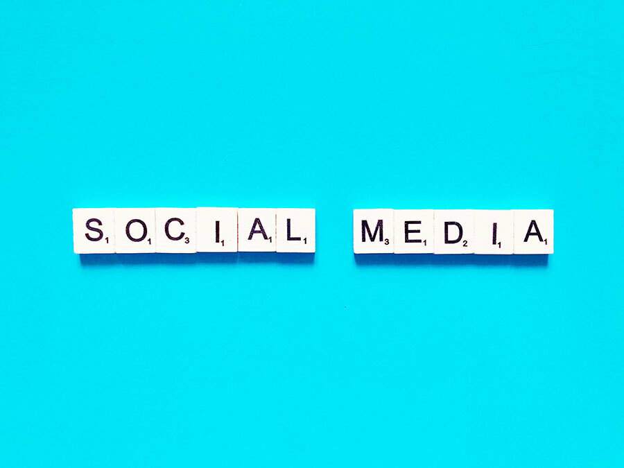 A blue background displays the word "social media" in an eye-catching manner.
